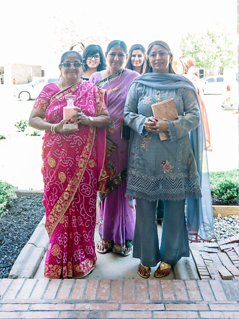 Groom's women of the family with gifts at Indian engagement ceremony